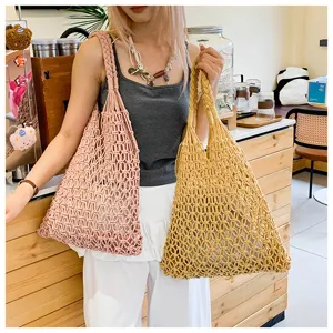 Stylish woven cotton rope hollow-out tote bags in pink and yellow for beach or daily use