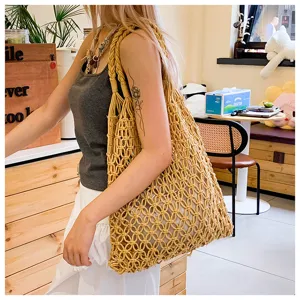 Handmade yellow cotton rope macrame tote bag with hollow mesh design for summer