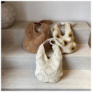Set of three handmade crochet cotton shoulder bags featuring sunflower and rustic woven designs