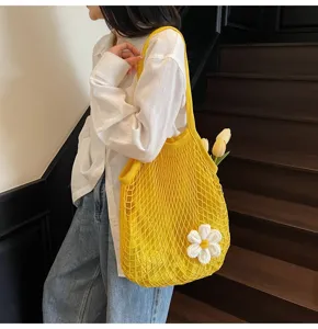 Stylish yellow mesh hollow-out tote bag with white flower detail for summer beach