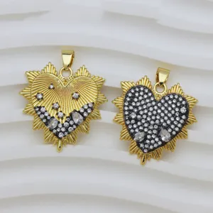 Macro view of 18k gold plated sunray heart pendants with sparkling cubic zirconia