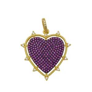 Detailed view of a gold-plated heart pendant inlaid with purple and white zircons