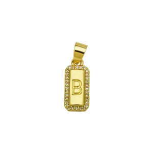 Macro view of a square 18K gold plated pendant featuring zircon border and letter B