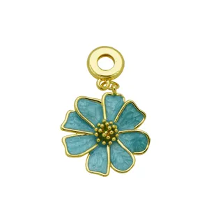 Detailed close-up of an elegant blue enamel flower pendant with 18K gold plated finish