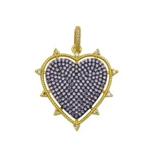 Detail view of a gold-plated heart pendant with elegant purple zircon pavé setting