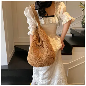 Close-up detail of a handmade brown sunflower crochet woven shoulder bag for women