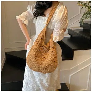 Hand-crocheted sunflower straw shoulder bag with hollow-out knit texture detail