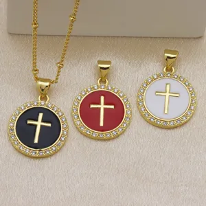 Gold plated cross pendant necklace with black red white enamel and cubic zirconia stones.