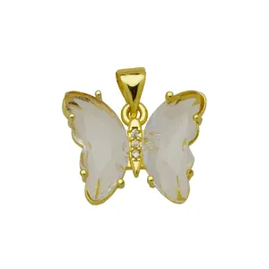 Close-up detail of the gold-plated butterfly pendant featuring sparkling clear crystal wings.