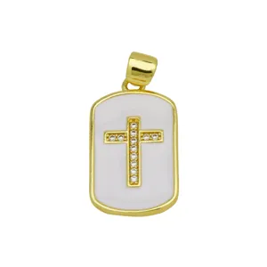 Gold plated cross pendant with white enamel and sparkling stones, elegant jewelry accessory.