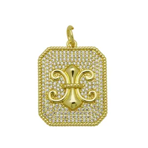 Detailed macro view of an 18k gold plated brass pendant set with pavé cubic zirconia