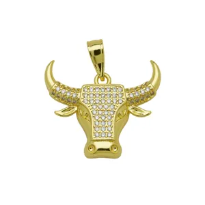 Detailed view of gold plated bull head pendant with sparkling cubic zirconia stones