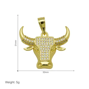 Gold bull head pendant with zircon stones showing 31mm x 30mm dimensions and 5g weight