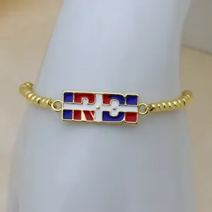 Gold-plated enamel national flag map theme charm bracelet detail, stylish fashion hand jewelry.