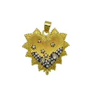 Detailed close-up of 18k gold plated heart pendant with sparkling white cubic zirconia