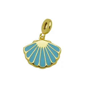 Detailed close-up of a gold-plated copper seashell charm featuring light blue enamel