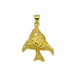 Detailed macro view of an 18K gold plated conch shell pendant with intricate texture