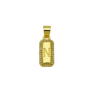 Close-up view of a square 18K gold plated copper letter N pendant with zircon stones