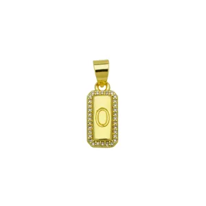 Close-up of rectangular 18K gold plated pendant with letter O and zirconia border