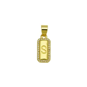 Close-up of gold-plated rectangular pendant with zircon border and engraved letter S
