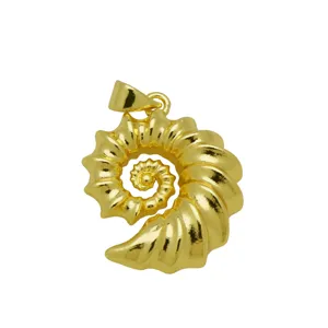Detailed macro view of a 18K gold plated ammonite shell pendant for jewelry making.