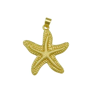 Gold starfish pendant detail showing textured beaded surface and loop for necklace use.