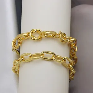 Detailed shot of trendy 18k gold plated chunky chain bracelets with unique link design.