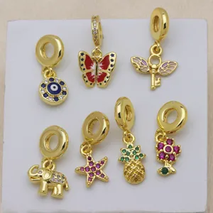 Gold-plated charm pendant detail, compatible with European bracelets, colorful cubic zirconia.