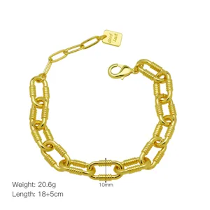 Chunky 18K gold plated O-chain bracelet with extended chain and lucky charm pendant.