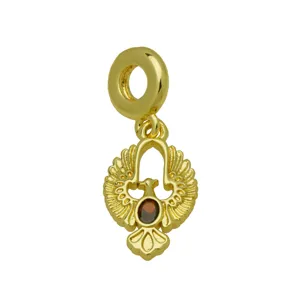 Gold tone phoenix bird charm pendant with dark stone, detailed wings, jewelry making supply.