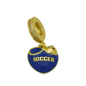 Gold plated soccer heart charm with blue enamel and sparkling cubic zirconia stones detail.