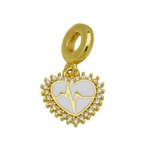 Gold-plated heart charm detail featuring white enamel and sparkling crystal pavé border.
