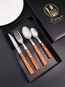 Stainless steel cutlery set with wooden handle, includes steak knife, fork, and spoons for dining.