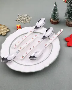 Detailed close-up view of Christmas stainless steel spoons featuring cute festive handle patterns.