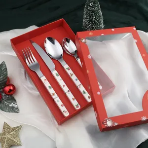 Christmas stainless steel cutlery set detail, featuring cute holiday patterns on handles.