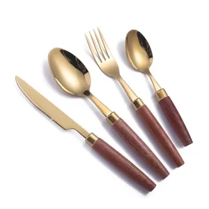 Gold stainless steel cutlery set with wood handle table knife fork spoon 4pcs kitchen dining table.