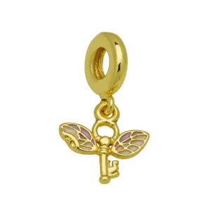Gold winged key charm pendant with vibrant enamel details, compatible with snake chain bracelets.