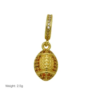 Gold plated American football charm pendant with orange and white crystal stones for bracelet.