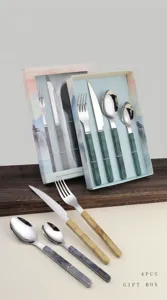 Stainless steel cutlery set with marble pattern handle and gift box detail showcase.