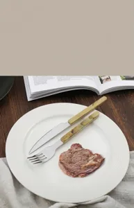 Stainless steel knife and fork set with marble pattern handle, elegant western tableware for dining.