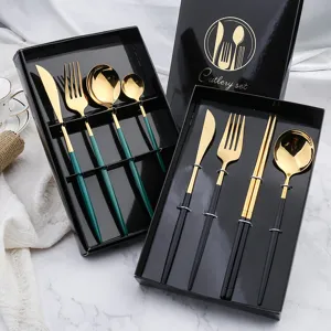 Stainless steel cutlery set with knife fork spoon chopsticks in luxury black gift boxes.