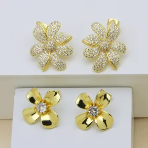 Gold plated flower earrings set featuring sparkling cubic zirconia and elegant floral designs.