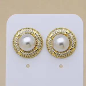 Vintage gold plated pearl stud earrings with sparkling cubic zirconia, elegant jewelry.