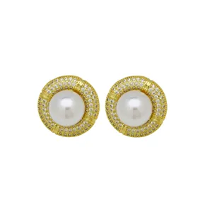 Detailed close-up shot of elegant gold-plated pearl and cubic zirconia stud earrings.