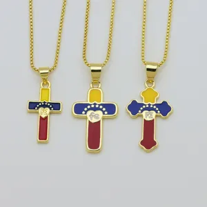 Gold-toned cross pendant necklace set featuring vibrant enamel flag colors and cute heart details.