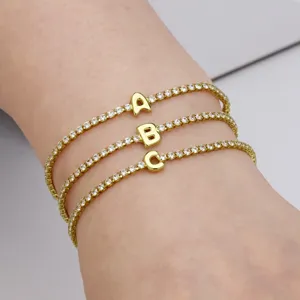 Gold tennis bracelets featuring sparkling cubic zirconia and cute bubble letter charms for women.