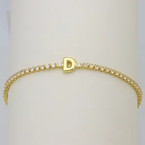 Gold tennis bracelet with letter D charm sparkling cubic zirconia stones detail view fashion jewelry