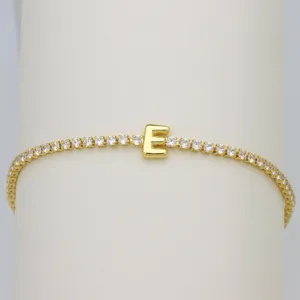 Gold-plated tennis bracelet featuring a cute balloon letter E charm with sparkling cubic zirconia.
