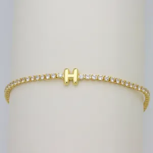 Gold-tone tennis bracelet featuring a cute bubble letter H charm with sparkling cubic zirconia.
