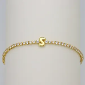 Gold tennis bracelet with sparkling cubic zirconia and a cute puffy letter S charm for women